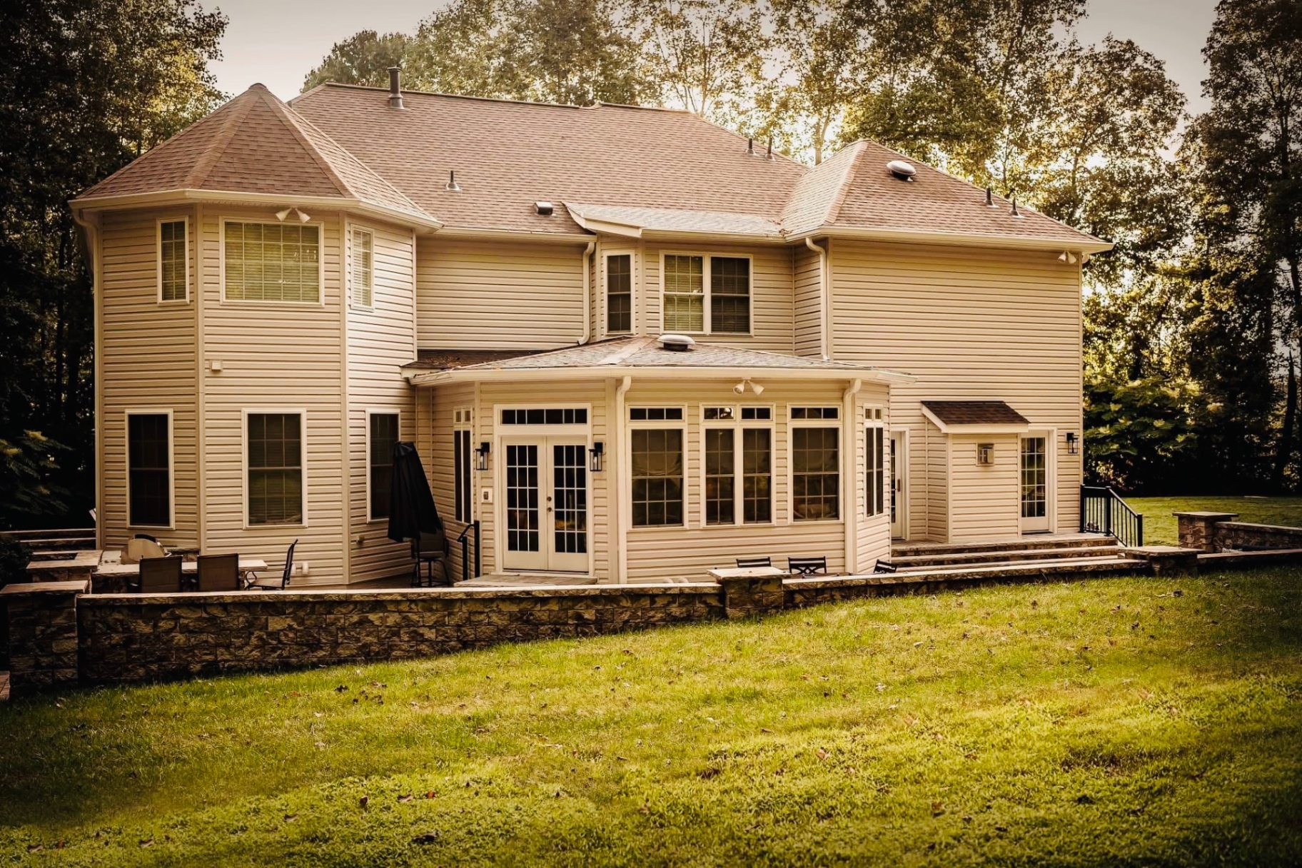 Two-story home with sunroom addition