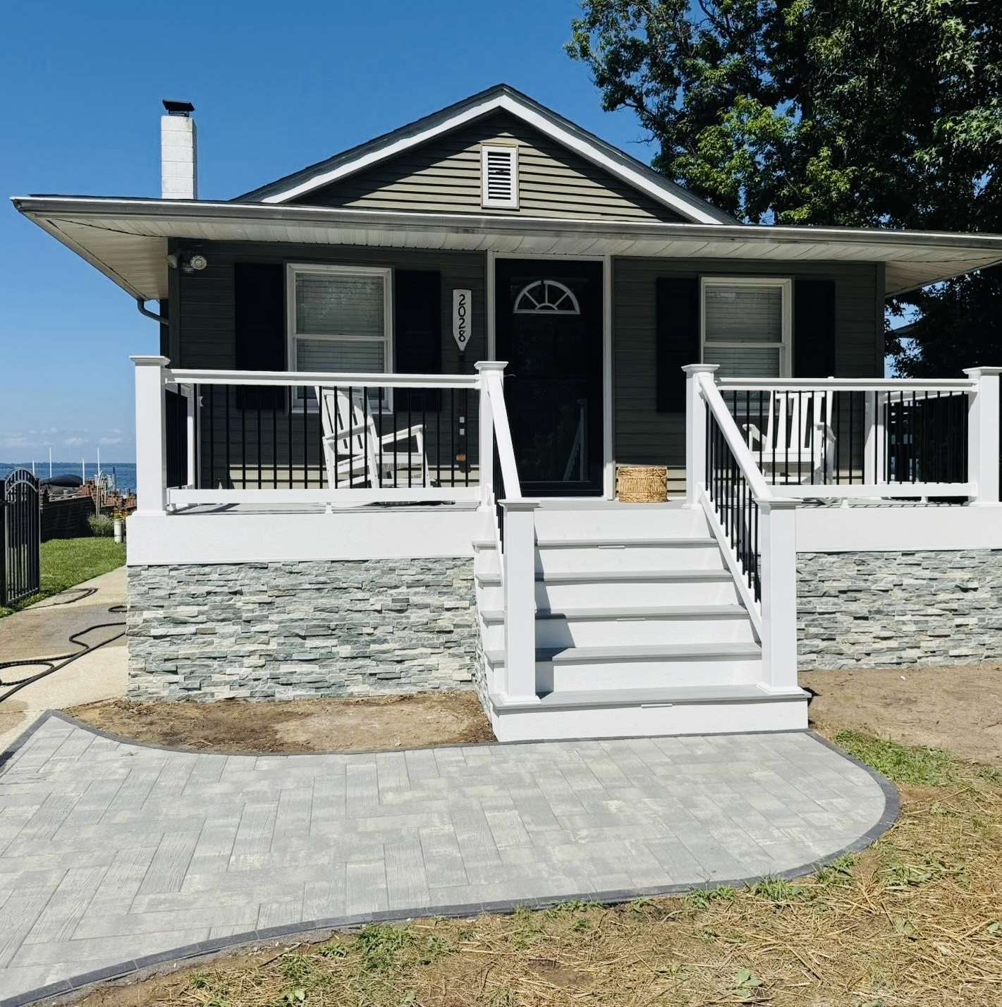 Waterfront cottage with stone porch and pavers