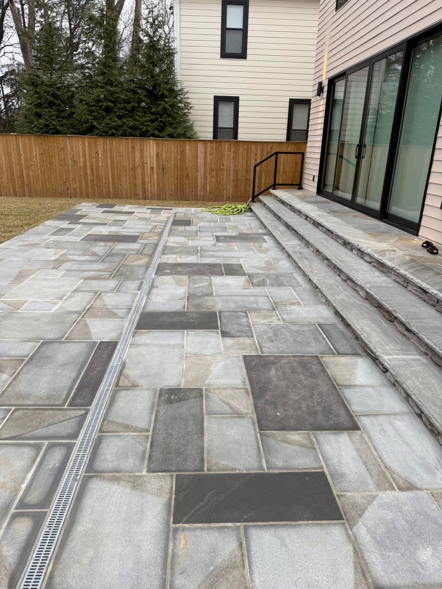 Flagstone patio with linear drain